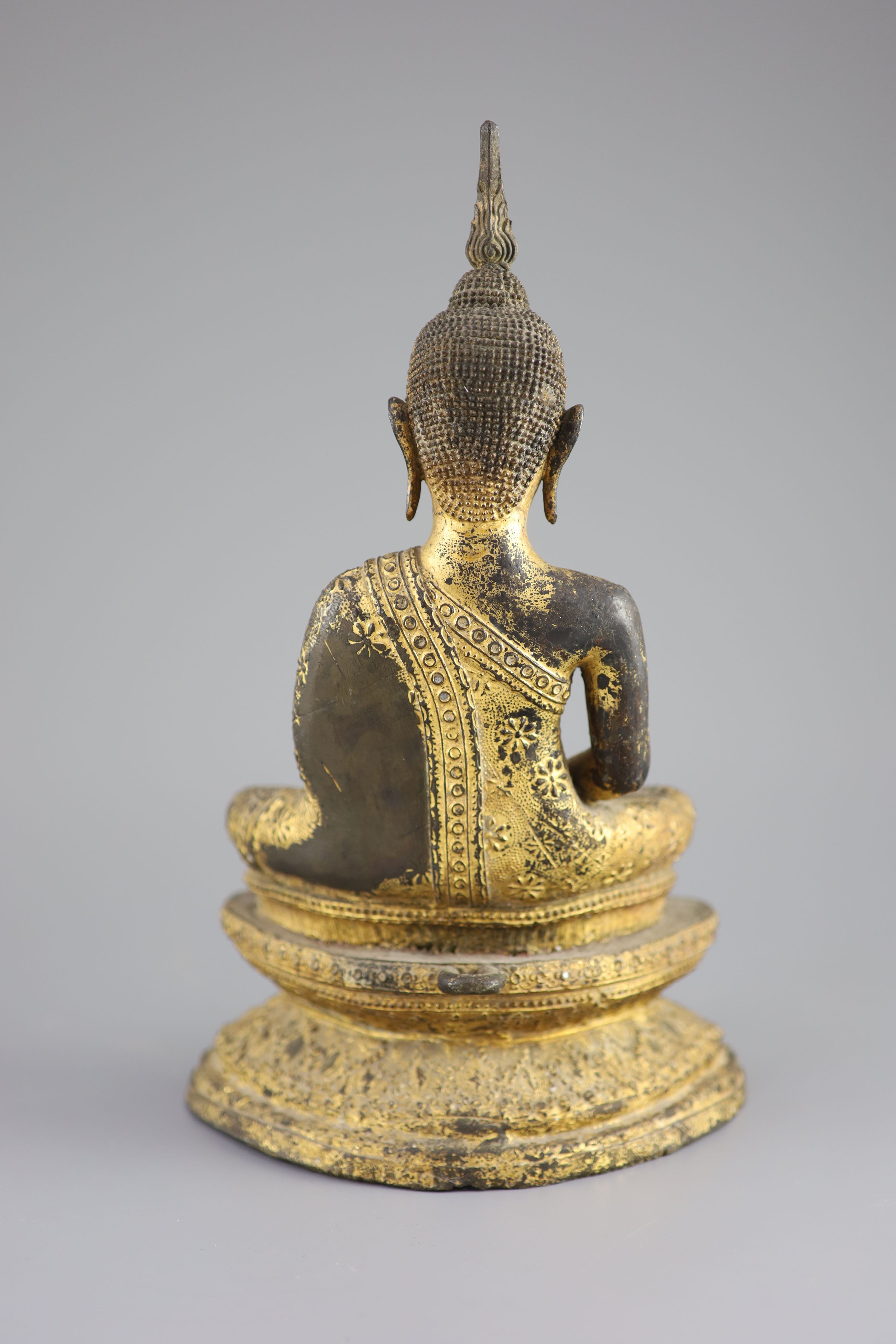 A Thai gilt bronze seated figure of Buddha, 18th/19th century, 33 cm high